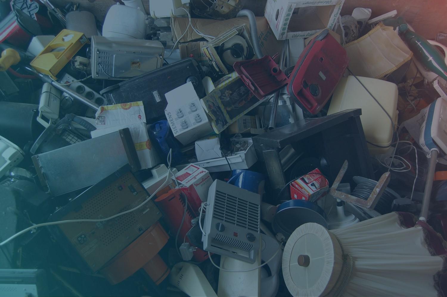 A photograph that symbolizes ewaste (a lot of electronical rubbish thrown together).