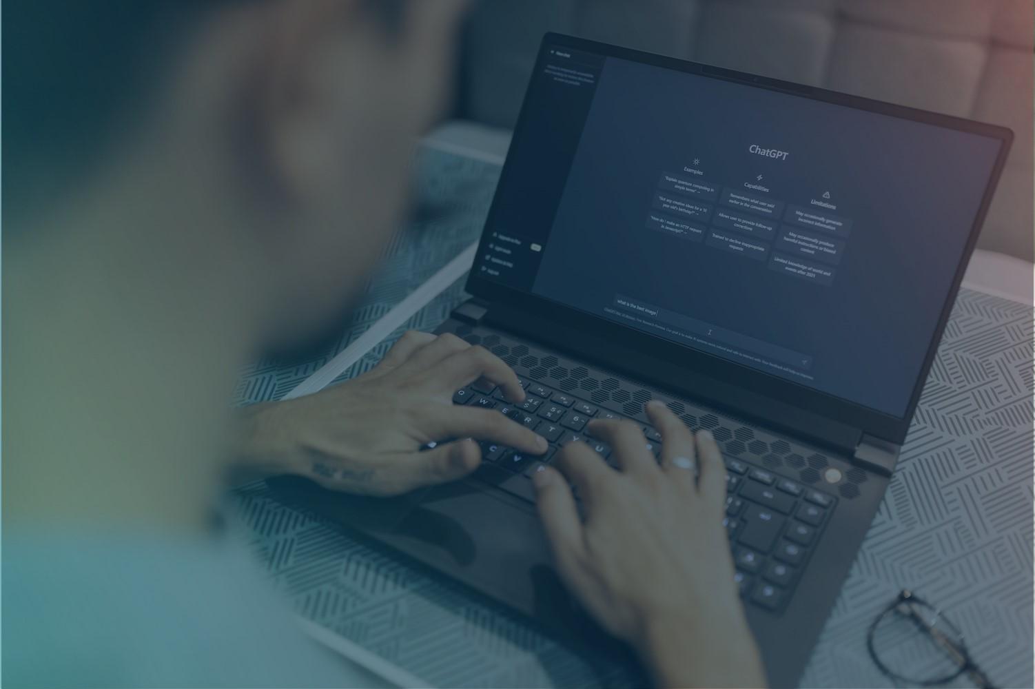 Man typing something in ChatGPT, symbolizes AI.